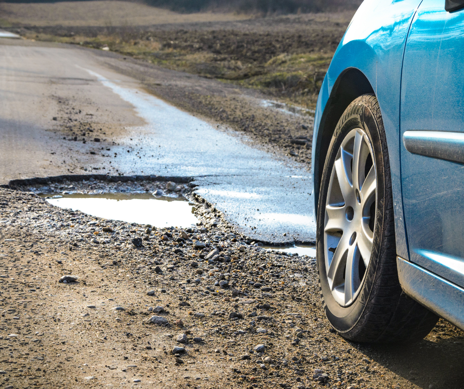 Winter pot hole on open road